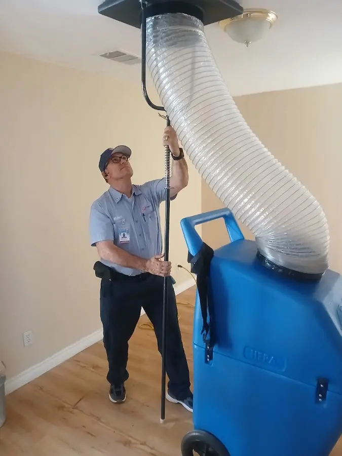 Furnace Tune-Up technician using HEPA equipment in Berkeley